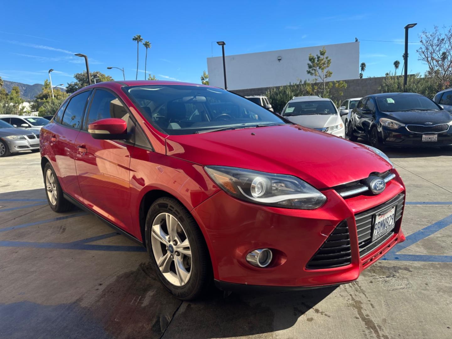 2012 RED /BLACK Ford Focus SE Sedan (1FAHP3F29CL) with an 2.0L L4 DOHC 16V engine, AUTOMATIC transmission, located at 30 S. Berkeley Avenue, Pasadena, CA, 91107, (626) 248-7567, 34.145447, -118.109398 - New Tires! Nice Interior! drives and looks good! Bad credit? We can help! We are the bank. All our cars are thoroughly inspected and reconditioned by our technicians. FREE CARFAX report. Stop by or call to speak with our friendly staff. Whether you have bad credit, no credit, bankruptcy, or reposse - Photo#6